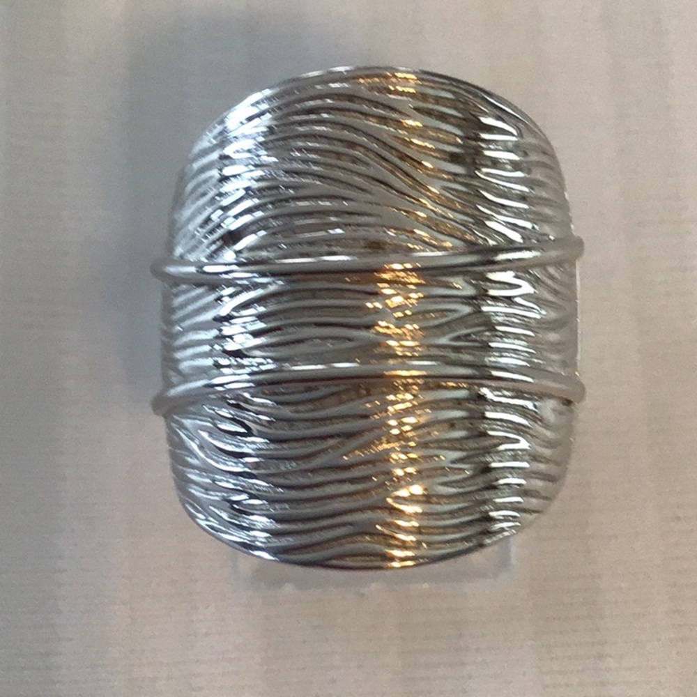 Rhodium plated Sterling Silver with Ruby accent.